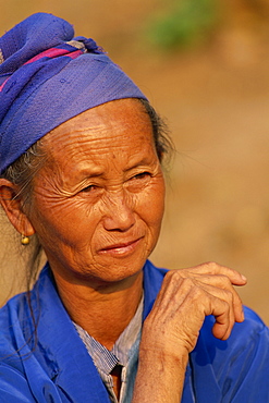 Portrait of a Hmong Hill tribe woman with traditional costume in northern Laos, Indochina, Southeast Asia, Asia