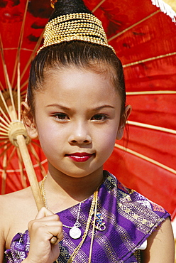 Young Laotian girl in traditional dress holding a red parasol, Laos, Indochina, Southeast Asia, Asia