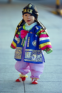 Portrait of a small boy in traditional costume on his first birthday, in Seoul, Korea, Asia