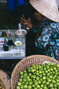 Woman eating pho (noodles) at food stall, Cholon market, Ho Chi Minh City (formerly Saigon), Vietnam, Indochina, Southeast Asia, Asia