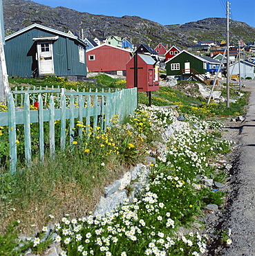 Typical wooden houses with fences at Julianehab, Greenland, Polar Regions