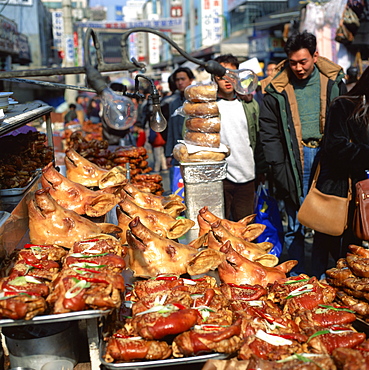 Pigs heads on a stall in a street market in Seoul, South Korea, Asia