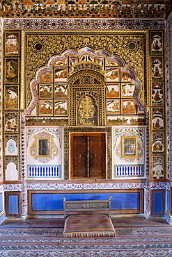 Painted wall and raised plaster work which has been gilded, Mehrangarh Fort, Jodhpur, Rajasthan state, India, Asia