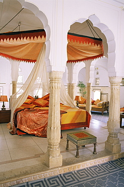 Traditional Rajput columns and cuspid arches in tented guest bedroom, Samode Palace Hotel, Samode, Rajasthan state, India, Asia