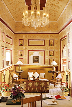 Reception area for arriving guests with reproduction colonial style furniture, painted walls and ceiling, Samode Palace Hotel, Samode, Rajasthan state, India, Asia