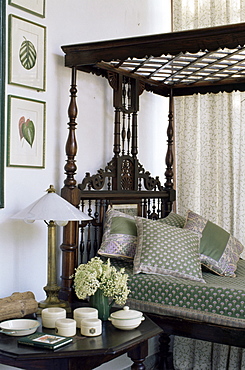 Colonial style four poster bed and antique enamel ware on bedside table, in residential home, Dehra Dun, Himalayan foot hills,Uttar Pradesh state, India, Asia