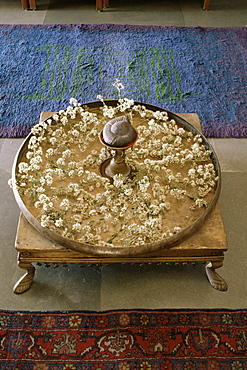 Flower arrangement in traditional brass thali, in a residence, Ahmedabad, Gujarat state, India, Asia