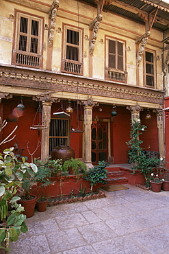 Restored traditional Pol house, an all wood structure, with wood carved facade, some 300 to 400 years old, Ahmedabad, Gujarat state, India, Asia