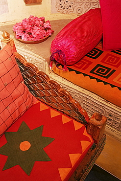 Bright furnishings in modern residential home in traditional tribal Rabari round mud hut, Bunga style, near Ahmedabad, Gujarat state, India, Asia