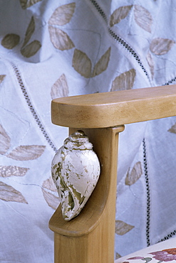 Detail of the arm of a drawing room chair in new build home, New Delhi, India, Asia