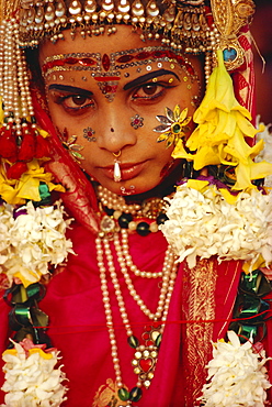 Portrait of a young actor in jewels and make-up as Sita, wife of Rama, from the Ramlilla, the stage play of the great Hindu Epic, the Ramayana, Varanasi (Benares), Uttar Pradesh State, India