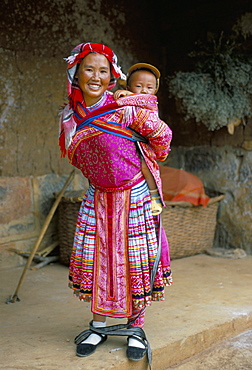 Portrait of a Miao girl with baby carrier, Qiubei, Yunnan, China, Asia