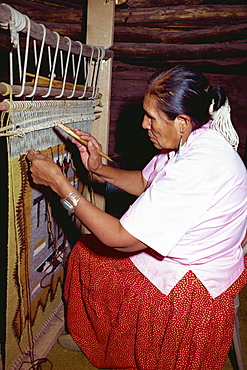 Navajo Indian woman weaving on a vertical loom, New Mexico, United States of America, North America