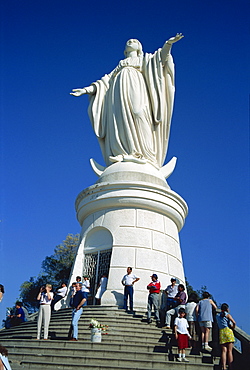 Tourists below a statue of the Virgin Mary, Cerro San Cristobal, Santiago, Chile, South America