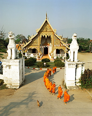 Monks leaving Wat Phra Singh to collect alms, Chiang Mai, Thailand, Southeast Asia