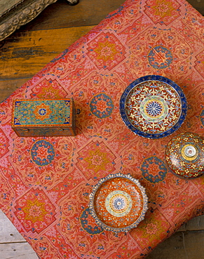 Overhead view of Bencharong ceramics and silk designed by Jim Thompson, Jim Thompson's House, Bangkok, Thailand, Southeast Asia, Asia