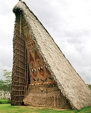 House Tamberan, or ceremonial building, photographed in 1974, only initiated warriors were allowed inside and in the days of cannibalism, a victim's head from a neighbouring tribe was hung above the entrance as a warning to those not properly initiated, Maprik, Sepik River, Papua New Guinea, Pacific