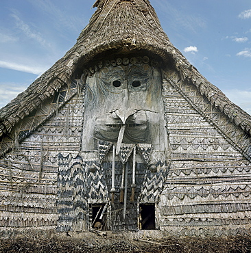 House Tamberan of Angoram housing the Tambaran statue, on the Sepik River, photographed in 1974, only initiated warriors allowed inside on penalty of death, in the days of cannibalism, a victim's head from a neighbouring tribe was hung above the entrance to warn to those not properly initiated, Papua New Guinea, Pacific