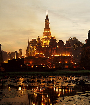 Temple illuminated during Loy Krathong Festival, Sukhothai, Thailand, Southeast Asia, Asia