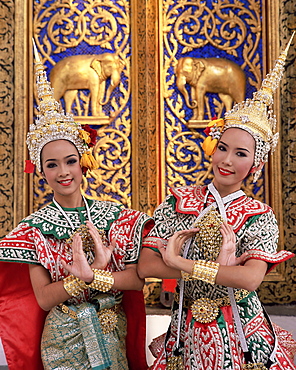 Portrait of two dancers in traditional Thai classical dance costume, smiling and looking at the camera, Bangkok, Thailand, Southeast Asia, Asia