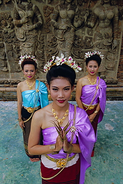 Portrait of three traditional Thai dancers, Chiang Mai, northern Thailand, Asia