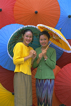 Portrait of two young women, Bo Sang umbrella village, Chiang Mai, northern Thailand, Asia