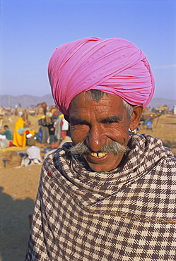 Portrait of a man in a colourful pink turban, Pushkar, Rajasthan State, India, Asia