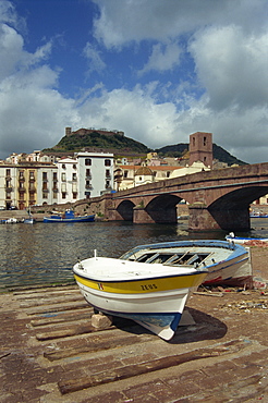 Boats beside a bridge over the Temo River at Bosa on the island of Sardinia, Italy, Europe