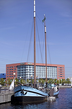 Preserved sailing ship Sir Henry Johnson, Holiday Inn beyond, Royal Victoria Dock, Newham, Docklands, London, England, United Kingdom, Europe