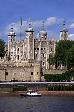 A police launch on the River Thames, passing the Tower of London, UNESCO World Heritage Site, London, England, United Kingdom, Europe 