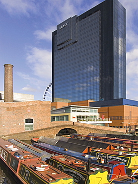 Narrow boats and barges moored at Gas Street Canal Basin, with Hyatt Hotel behind, city centre, Birmingham, Midlands, England, United Kingdom, Europe