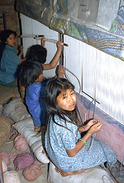 Portrait of child labourer in carpet factory, Bhaktapur, Kathmandu Valley, Nepal, Asia