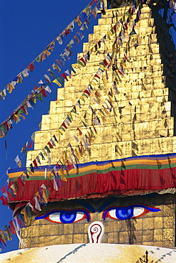 Buddha's eyes on gold leaf spire of one of the world's largest Buddhist stupas at Boudhanath, Kathmandu, UNESCO World Heritage Site, Nepal, Asia