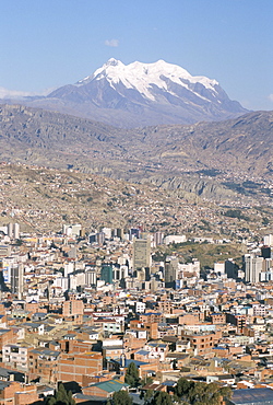 View across city from El Alto, with Illimani volcano in distance, La Paz, Bolivia, South America