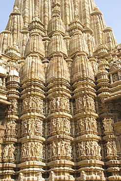 Detail of the main spire with some of the 646 erotic figures carved in sandstone on the Kandariya Mahadeva Temple, largest of the Chandela temples, within Western Group, Khajuraho, UNESCO World Heritage Site, Madhya Pradesh state, India, Asia