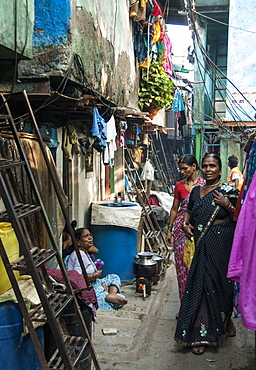 Narrow street and 2-layer houses, Colaba fishing village, southern end of Mumbai city, Maharashtra, India, Asia