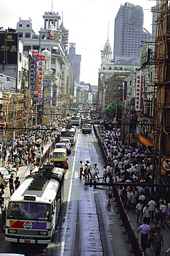 Nanjing Road, the main shopping street where cycles are banned to make space for buses, Shanghai, China, Asia