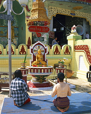 Two people praying at a pagoda, Yangon (Rangoon), Myanmar (Burma), Asia