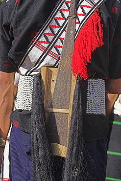 Naga man wearing belt with dao holder also known as Dhama (a type of machete) Naga New Year Festival, Lahe village, Sagaing Division, Myanmar (Burma), Asia