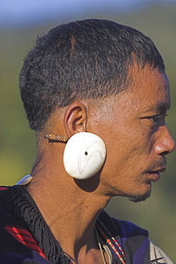 Naga man wearing conch shell ear ornament, Naga New Year Festival, Lahe village, Sagaing Division, MYANMAR (BURMA) 