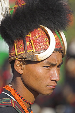 Naga man wearing headdress made of woven cane decorated with wild boar teeth and bear fur, Naga New Year Festival, Lahe village, Sagaing Division, Myanmar (Burma), Asia