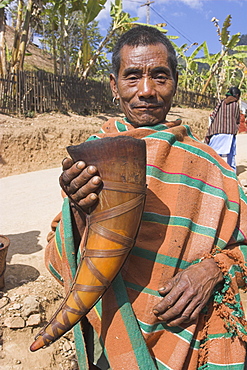 Naga man with horn used as drinking vessel, Naga New Year Festival, Lahe village, Sagaing Division, Myanmar (Burma), Asia