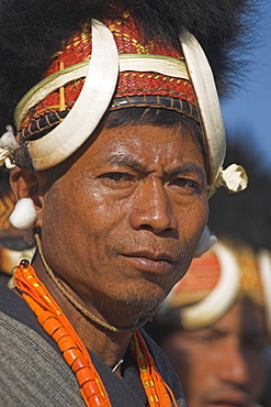 Naga men  wearing headdress made of woven cane decorated with wild boar teeth, and bear fur, Naga New Year Festival,  Lahe village, Sagaing Division, Myanmar (Burma), Asia