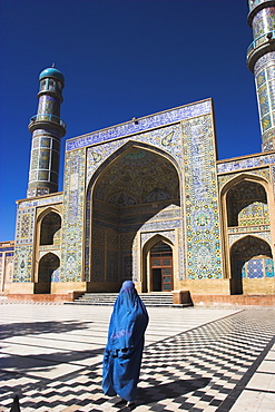 Lady wearing a blue burqua outside the Friday Mosque (Masjet-e Jam), Herat, Afghanistan, Asia