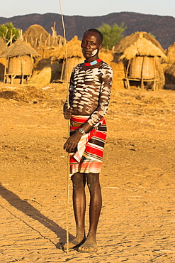 Karo man with body painting, made from mixing animal pigments with clay, at dancing performance, Kolcho village, Lower Omo valley, Ethiopia, Africa