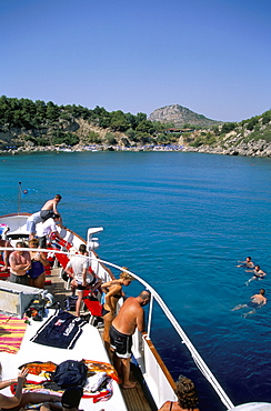 Boat trippers, east coast, Anthony Quinn's Bay, Rhodes, Greek Islands, Greece, Europe