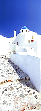 Blue domed church and whitewashed buildings, Oia, Santorini (Thira), Cyclades Islands, Greek Islands, Greece, Europe