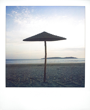 Polaroid image of brach parasol on deserted beach at dusk, Essaouira, Morocco, North Africa, Africa