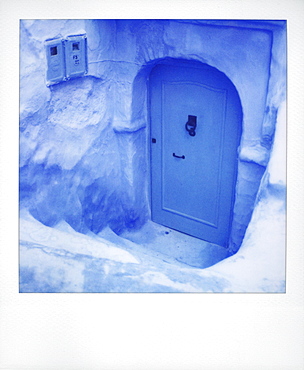 Polaroid of traditional painted blue door against bluewashed wall, Chefchaouen, Morocco, North Africa, Africa