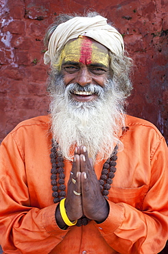 Sadhu (Holy Man) wearing brightly coloured clothing and characteristic facial painting at Pashupatinath Temple, Kathmandu, Nepal, Asia